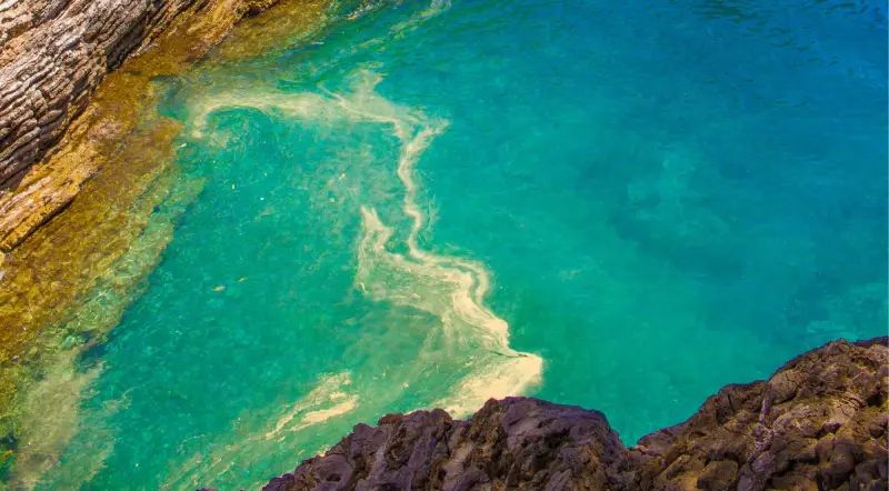 Clear turquoise Adriatic water against rocks on the Lustica Peninsula