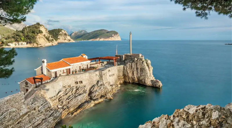 Stone coastal old town on a rocky outcrop above the Adriatic in Montenegro